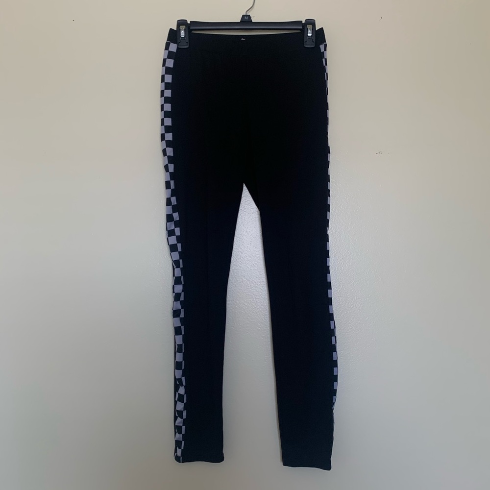 Black leggings with checkered pattern on the sides